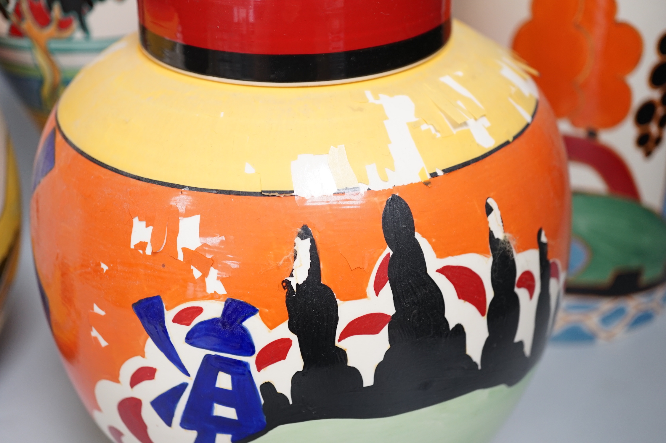Two Clarice Cliff reproduction Bizarre designed jars, a vase and a jug (decoration a.f.), tallest vase 30cm high